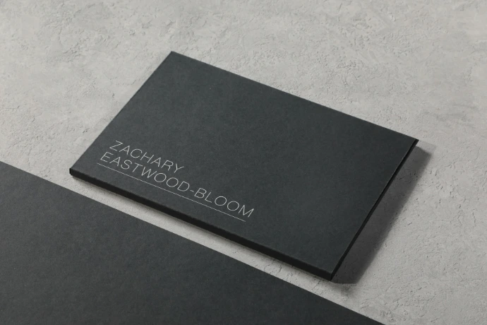 A black business card sitting on top of a table
