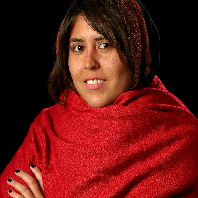 woman in red scarf smiling
